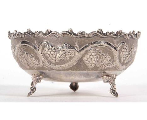 A vintage white metal 830-Cyprus bowl decorated with a vine and grape design and supported on three cast leaf feet, stamped b