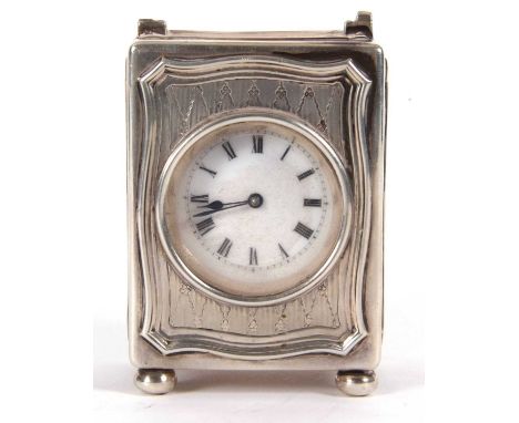 A George V silver cased boudoir carriage clock, the clock has a white enamel dial, black Roman numerals and minute ring, rect