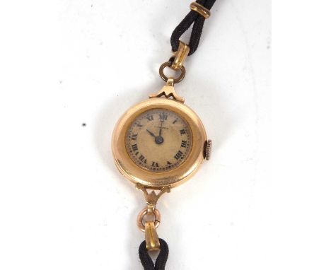A vintage Longines yellow metal wristwatch, the inside of the case back is stamped 14k, it has a fifteen jewel Longines stamp