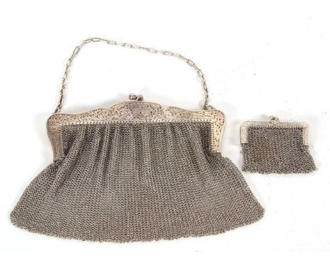 Mixed Lot: White metal ladies vintage mesh work evening bag with a floral pierced hinged frame and suspending chain together 