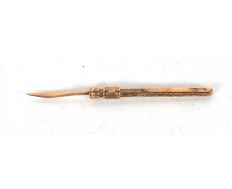 A vintage 9ct stamped retractable tooth pic, the barrel with chased detail, 45mm long, 1.8gms
