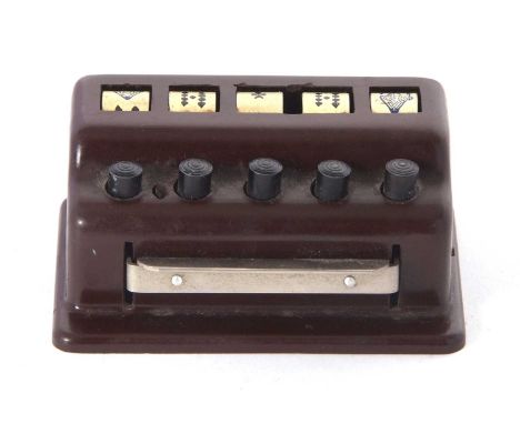 A vintage poker dice game, a push button rotating system featuring five hand painted poker die with revolving mechanism 8.5 x