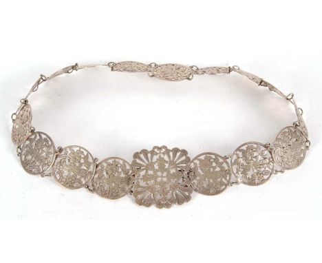 A vintage EPNS belt comprising sixteen circular pierced floral links to a square floral buckle, 68cm long