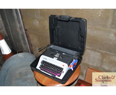 An Olympia typewriter in fitted carrying case