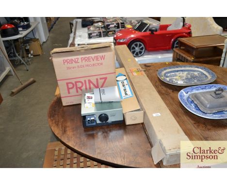 A Prince projector sold as collectors item together with a projector screen etc