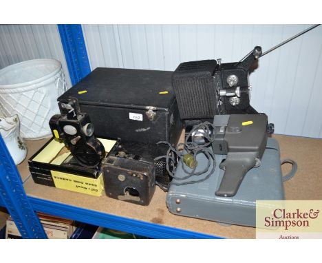 A Pathescope projector; a cine camera; a Kodascope projector etc.