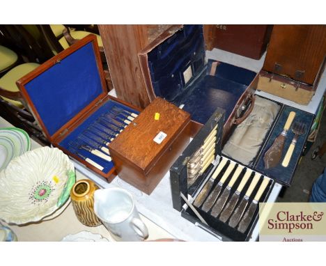 An oak stationery box, canteen of cutlery, fish knife and fork etc.