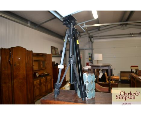 A light shade together with a camera tripod