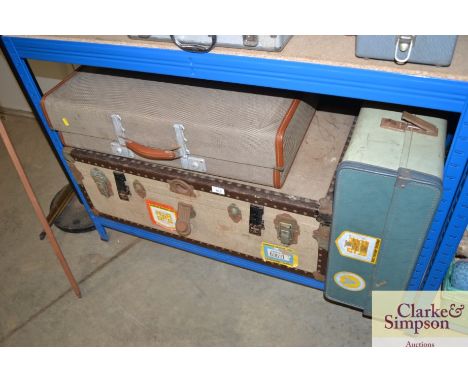 A travelling trunk and two suitcases 