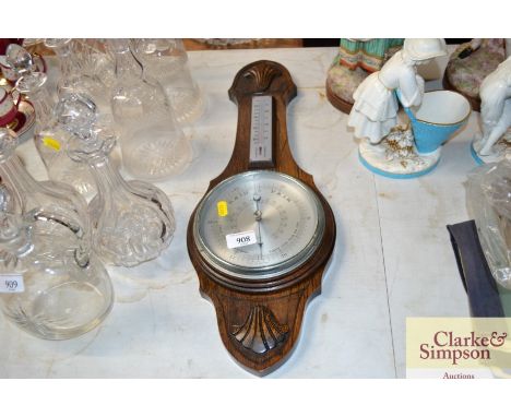 An oak case barometer