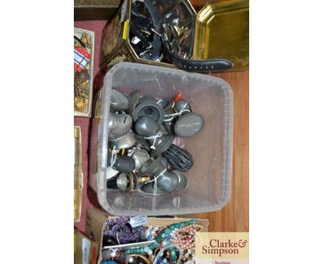 A box containing model military helmets and stands
