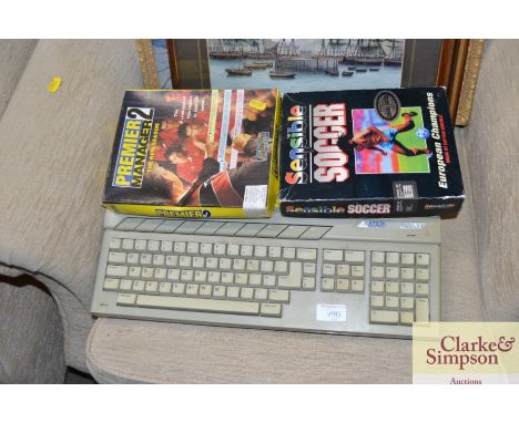 An Atari 520 SE and a quantity of games, sold as collectors item