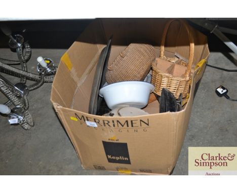 A box containing wicker baskets, enamel bowls and a pewter plate