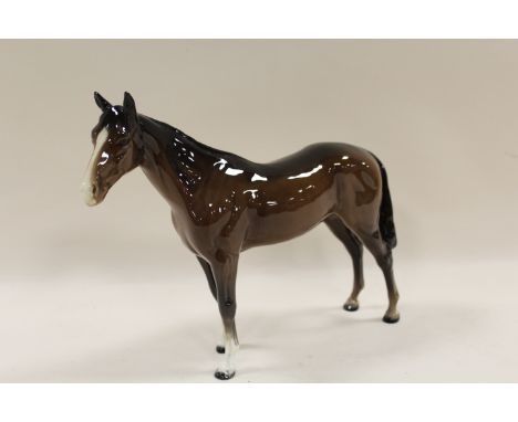 A BESWICK MODEL OF A HORSE IN BAY GLOSS FINISH