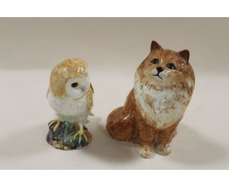 A BESWICK MODEL OF A SEATED CAT 1880 TOGETHER WITH A MODEL OF AN OWL (2)