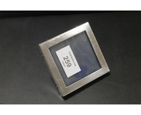 A SMALL SQUARE HALLMARKED SILVER PICTURE FRAME