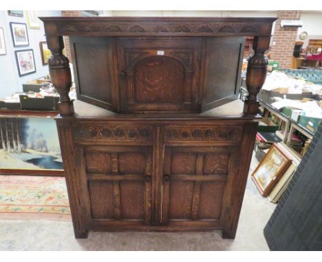 A VINTAGE OAK COURT CUPBOARD