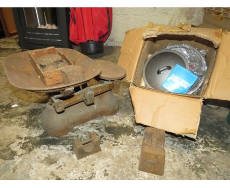 A SET OF COUNTER TOP WEIGHING SCALES WITH VARIOUS WEIGHTS AND A BOX OF CAST IRON COOKING POTS