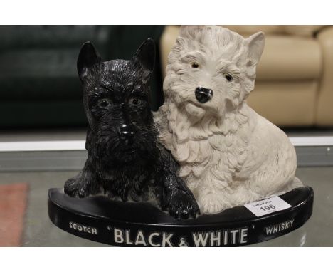 A VINTAGE BLACK AND WHITE WHISKY DOGS BAR DISPLAY