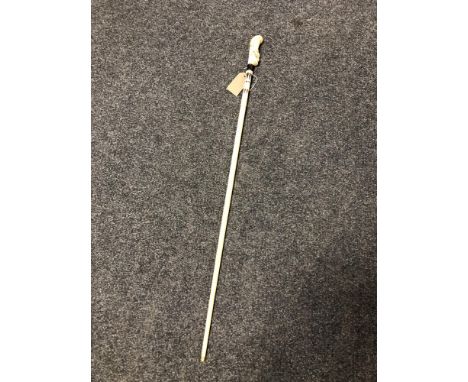 An antique carved ivory walking stick with bird to pommel, length 82 cm.