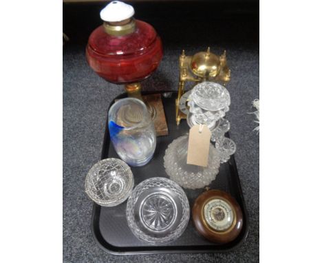 A tray of assorted glass - etched vase, decanter, rose bowl, Victorian cranberry oil lamp, brass carriage clock and barometer