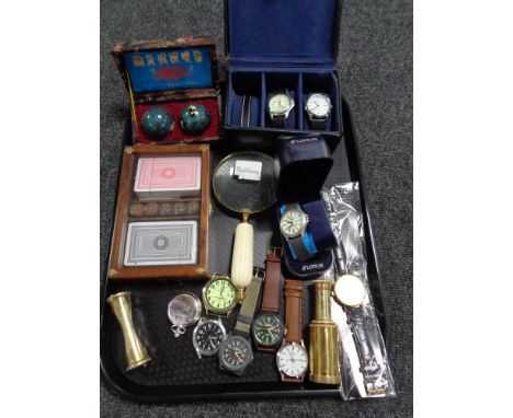 A tray of assorted gent's wristwatches including Timex, Expedition, Sekonda, together with a magnifying glass, card set, comp
