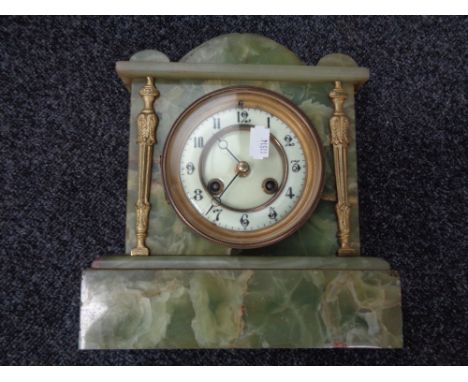 An onyx mantel clock with brass and enamel dial CONDITION REPORT: This has a pendulum. Mostly looks in good condition, the to