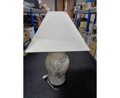 A decorative china table lamp with shade. 