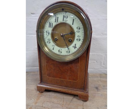 An Edwardian dome top mantel clock with brass and enamel dial  CONDITION REPORT: Dial with damages. 