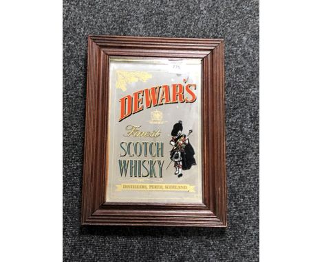 A framed Dewars Finest Scotch Whiskey advertising mirror 