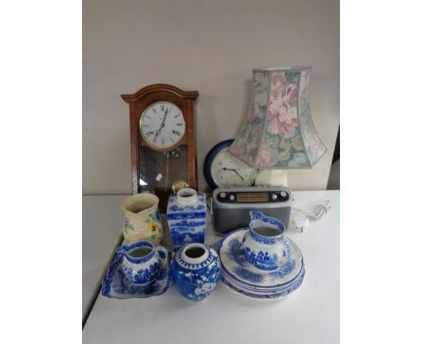 A box of Actim 31 day wall clock, table lamp with shade, Roberts radio, blue and white Willow pattern china etc 