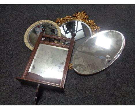 An Edwardian hall mirror with shelf and three further mirrors 