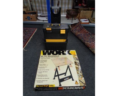 A boxed Worx high tilt work bench, rolling tool chest of spanners, tools and hard ware 