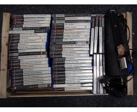 A crate of PS 2 console, controller and games 
