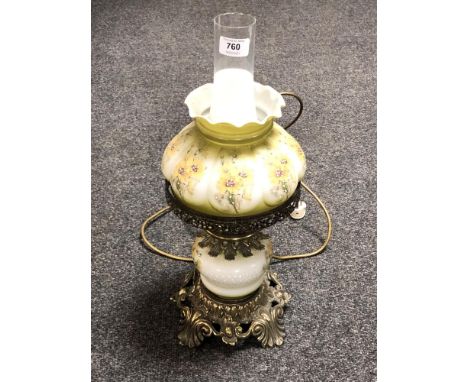 A brass and hand painted oil lamp with chimney and shade (converted) 