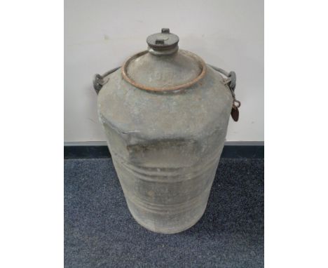 A 20th century galvanized canister with carry handle bearing BP advertisement 