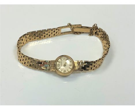 A lady's 9ct gold Jaeger-LeCoultre wristwatch on 9ct gold integral strap.  CONDITION REPORT: Gross weight 15g The watch is cu
