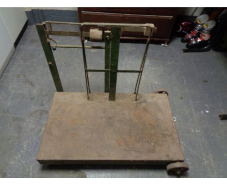 A vintage set of grain weighing scales on metal wheels 