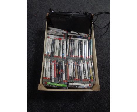 A box of PS 3 console, quantity of games and a controller 