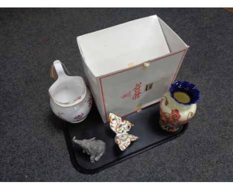 A tray of boxed Spode cabinet collection jug, Tupton ware vase, John Beswick elephant and a Regal butterfly figure 