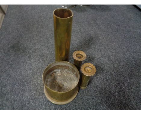 Four brass ammunition shells (Two in the form of candlesticks)