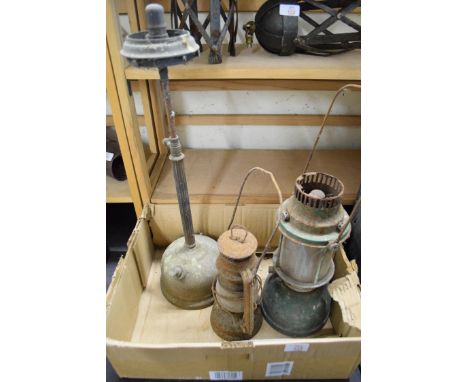 Box containing three vintage oil lamps