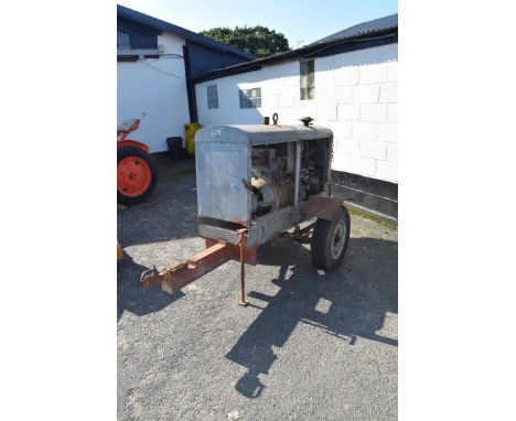 Hercules engine on a trailer hooked up to a Lincoln welder, used previously for on-site welding