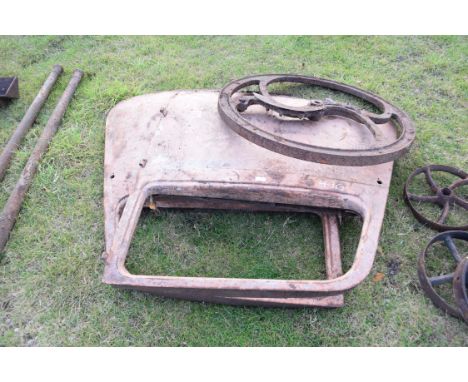 Pair of vintage car doors together with a large iron implement wheel