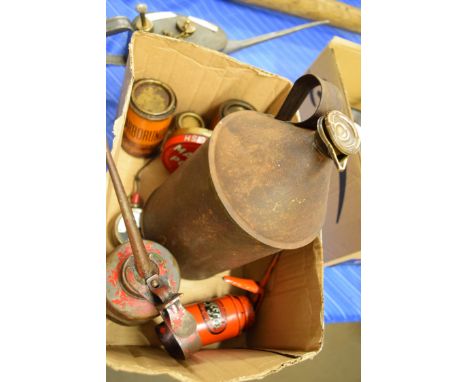 Box containing three oil cans, vintage voltmeter