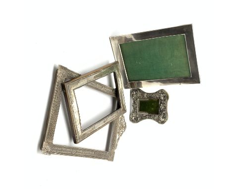 Silver perpetual calendar holder on an easel stand Birmingham 1904, two plain silver photograph frames and a plated frame  Co