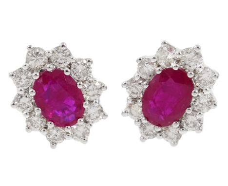 Pair of 18ct white gold ruby and dimaond cluster stud earrings, total ruby weight 1.9 carat, total diamond weight 1 carat