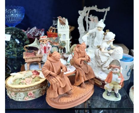 A COLLECTION OF DECORATIVE CERAMIC AND RESIN ORNAMENTS