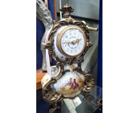 AN EARLY 20TH CENTURY CONTINENTAL CLOCK, with a ceramic case and ormolu mounts, 20cm high
