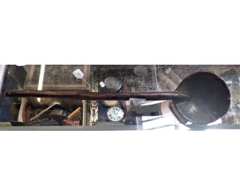 AN AFRICAN CARVED WOODEN TRIBAL LADLE 